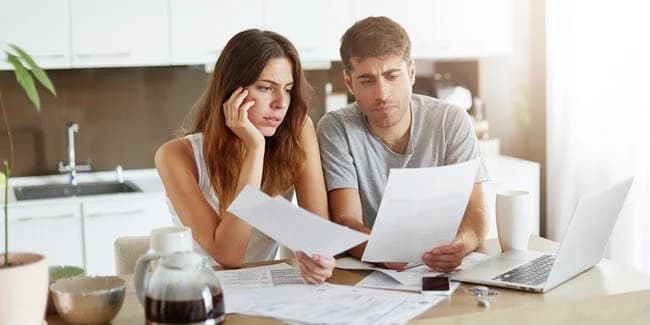 Confused taxpayer reviewing forms